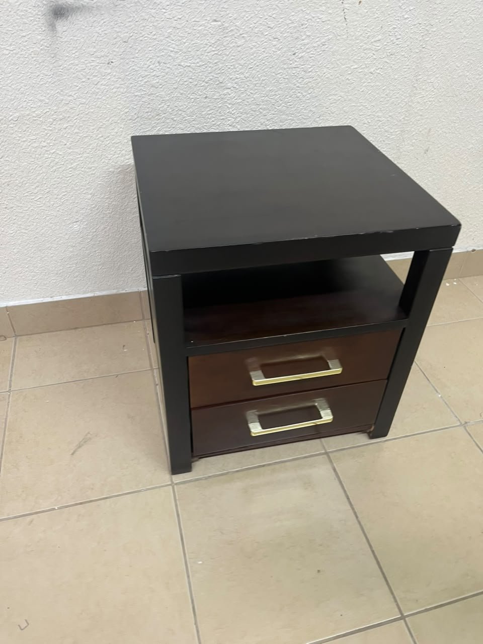 A modern wooden side table featuring two drawers and an open shelf, with a dark wood frame that contrasts with the reddish-brown drawer fronts, accented by slender metal handles. - Image 6