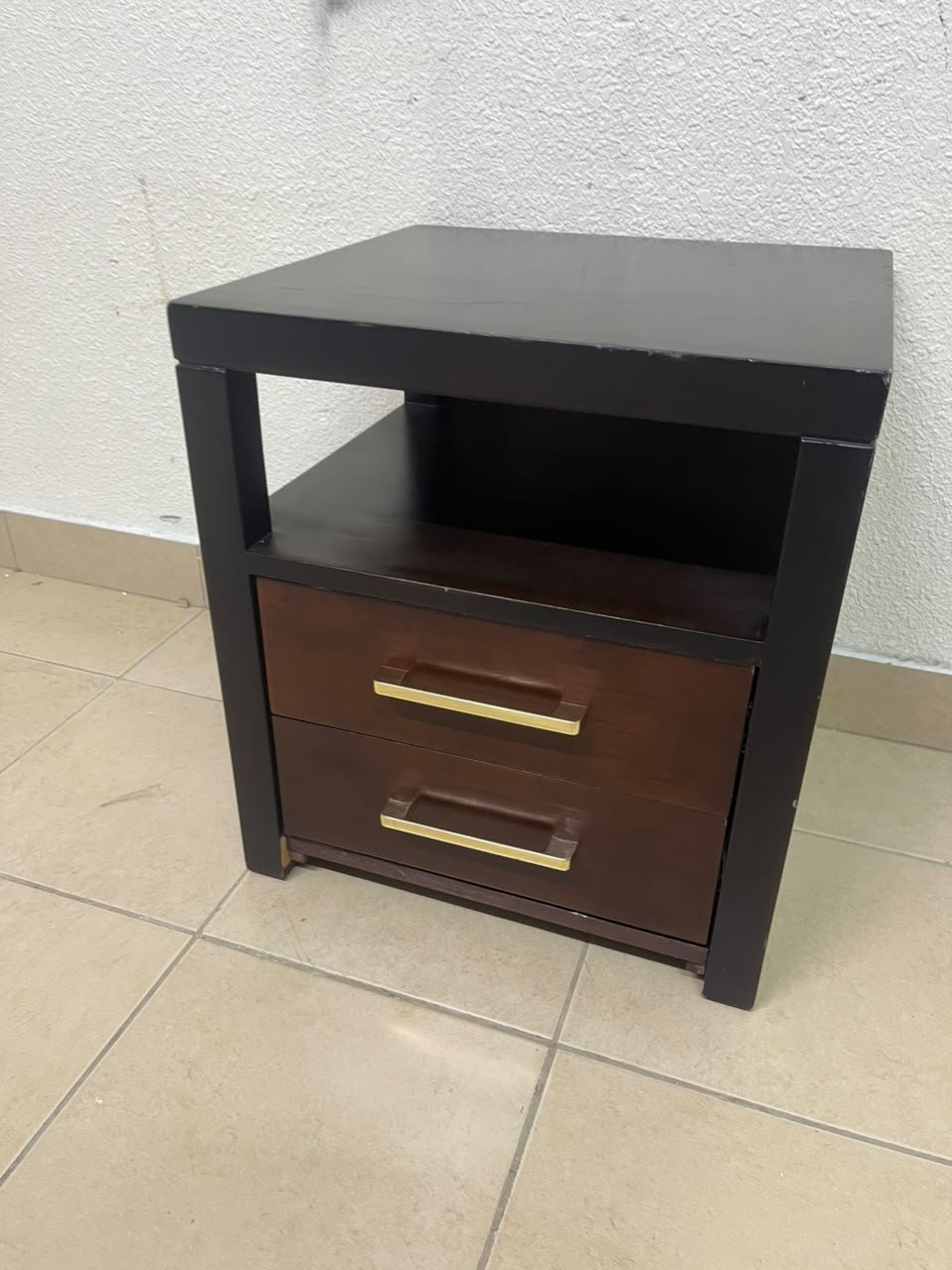 A modern wooden side table featuring two drawers and an open shelf, with a dark wood frame that contrasts with the reddish-brown drawer fronts, accented by slender metal handles. - Image 8