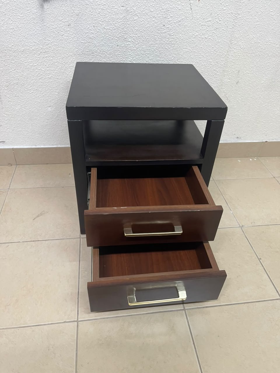 A modern wooden side table featuring two drawers and an open shelf, with a dark wood frame that contrasts with the reddish-brown drawer fronts, accented by slender metal handles. - Image 9