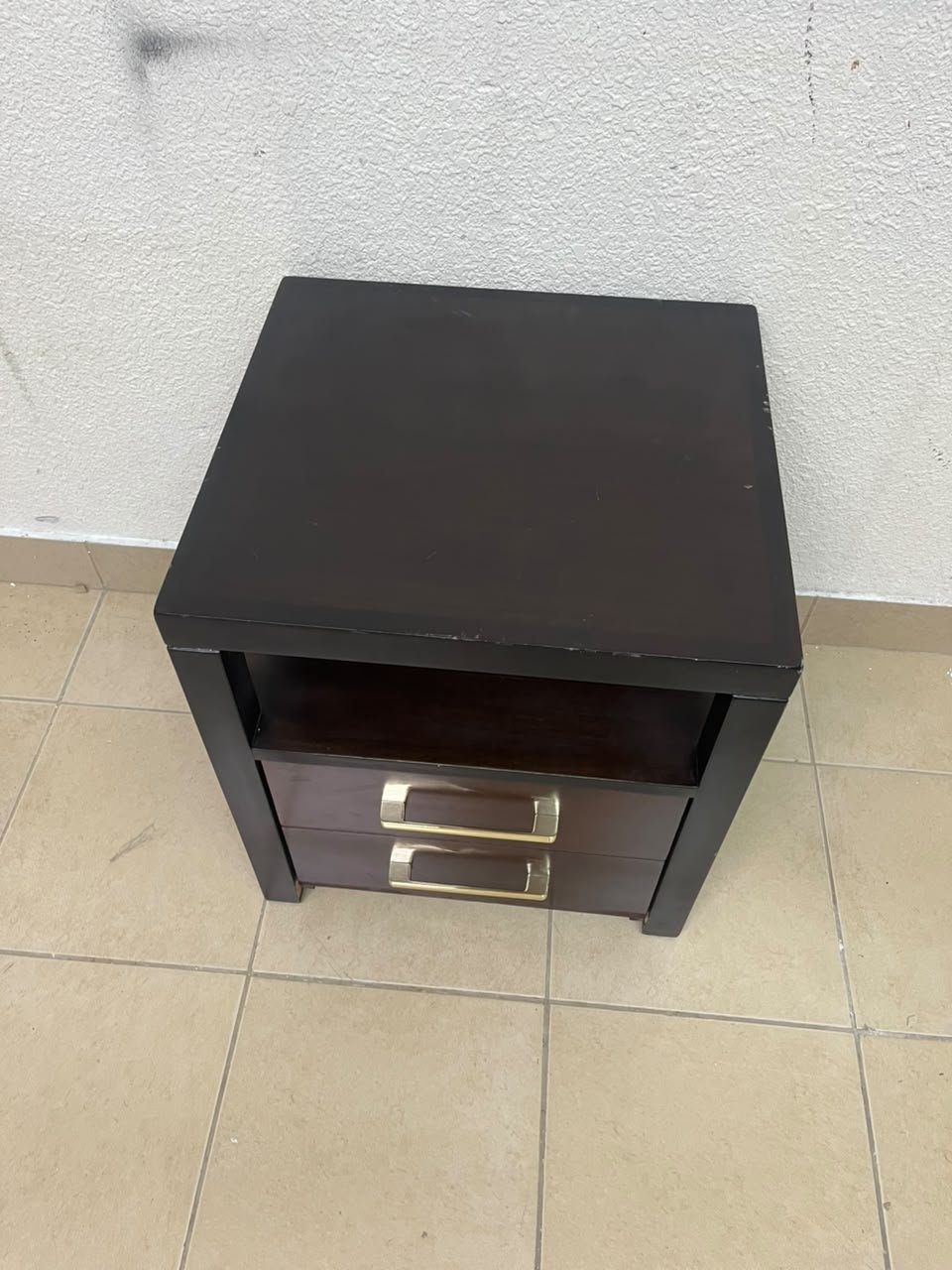A modern wooden side table featuring two drawers and an open shelf, with a dark wood frame that contrasts with the reddish-brown drawer fronts, accented by slender metal handles. - Image 10