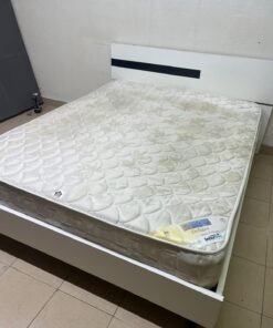 A white wooden bed frame paired with an "Intercoil Deluxe" sprung, cushioned mattress. - Image 2