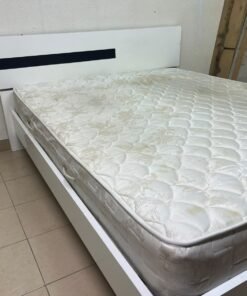 A white wooden bed frame paired with an "Intercoil Deluxe" sprung, cushioned mattress. - Image 5