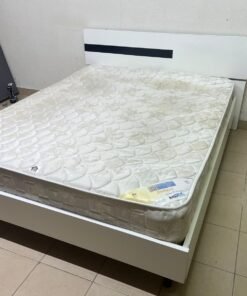 A white wooden bed frame paired with an "Intercoil Deluxe" sprung, cushioned mattress. - Image 9