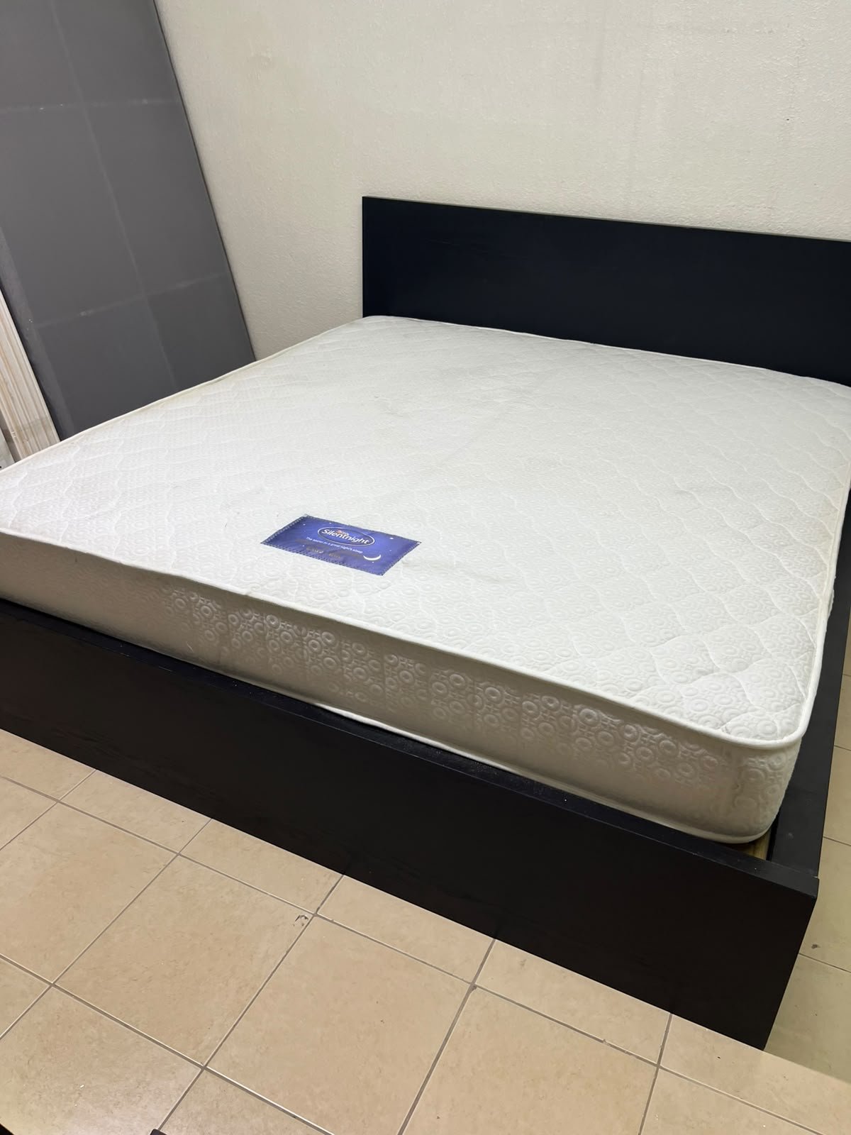 Black IKEA bed with a white "Silentnight Starlight" mattress. - Image 5