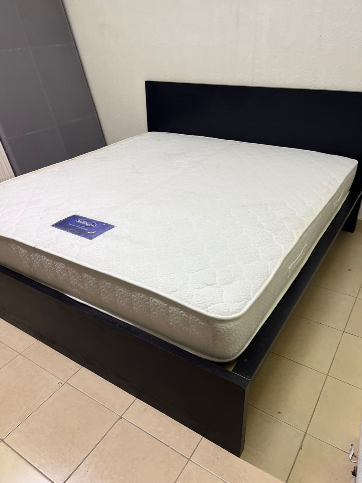 Black IKEA bed with a white "Silentnight Starlight" mattress. - Image 8