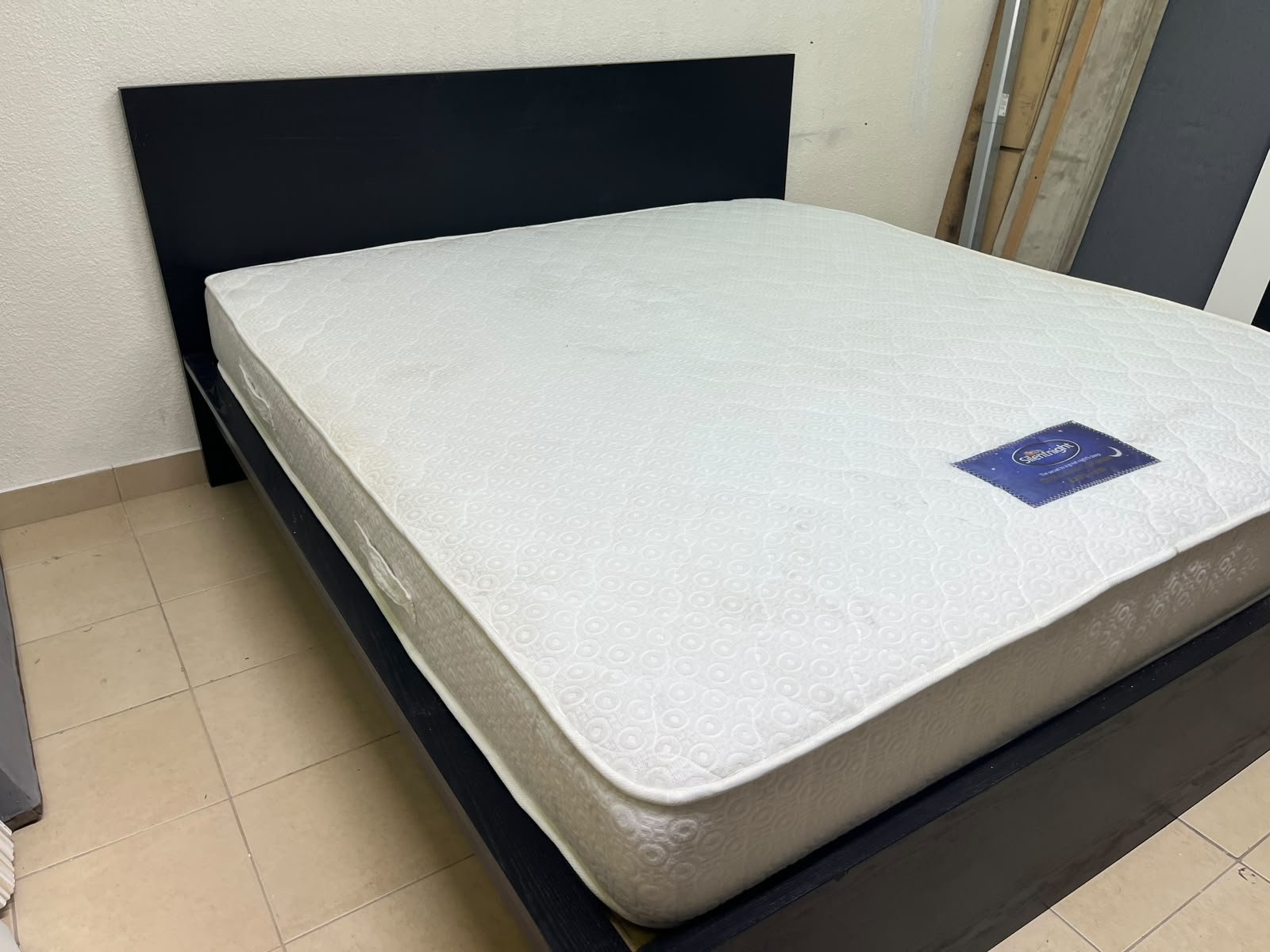 Black IKEA bed with a white "Silentnight Starlight" mattress. - Image 10