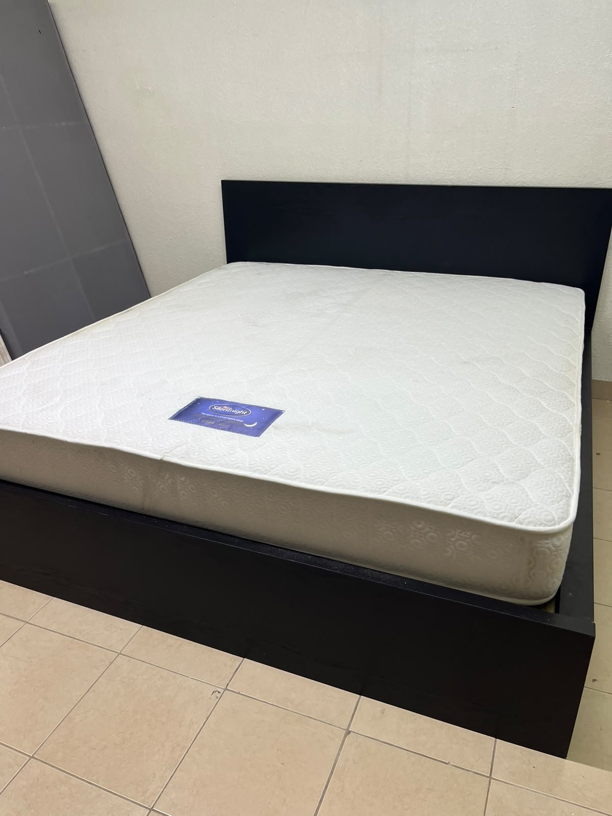 Black IKEA bed with a white "Silentnight Starlight" mattress. - Image 11