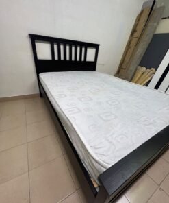 An IKEA "HEMNES" wooden bed frame in a black-brown finish, featuring a slatted headboard and a matching mattress. - Image 6