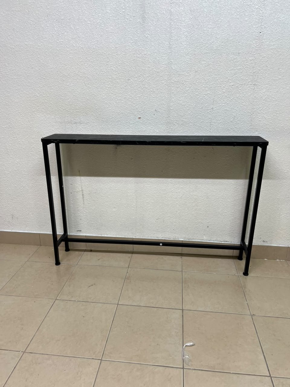 A console or sofa table—narrow and sleek—featuring a black metal frame and a rectangular top. - Image 2