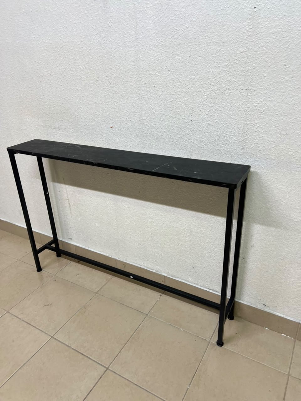 A console or sofa table—narrow and sleek—featuring a black metal frame and a rectangular top. - Image 3