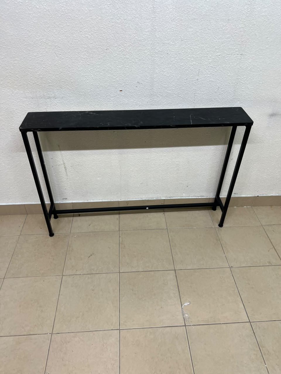 A console or sofa table—narrow and sleek—featuring a black metal frame and a rectangular top. - Image 4
