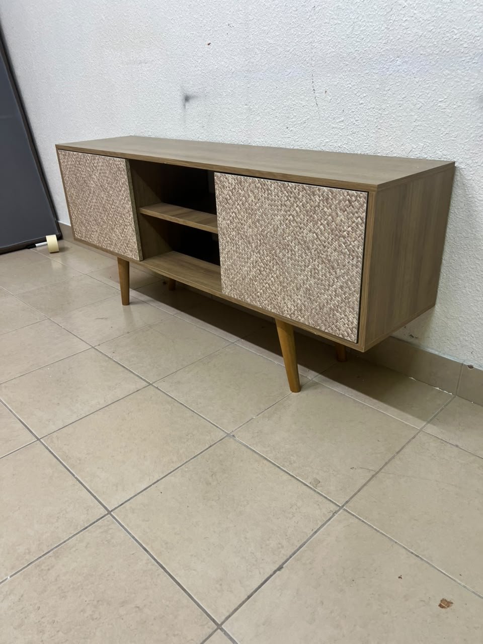 A modern wooden TV cabinet featuring distinctive textured woven doors and angled legs, closely resembling the Techno Mobili TV stand or Danube Home TV units. - Image 9