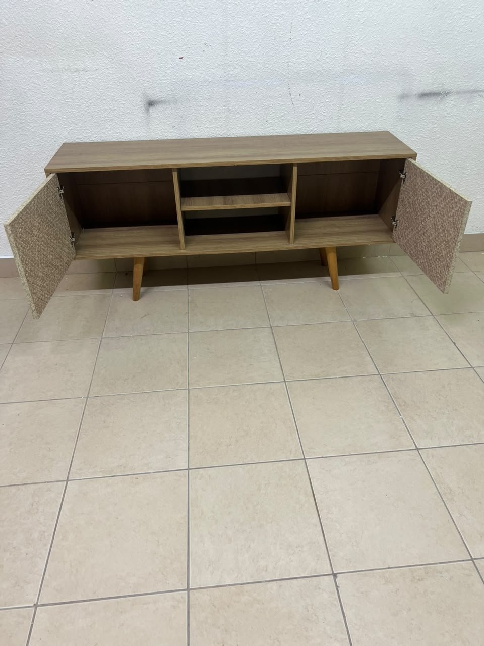 A modern wooden TV cabinet featuring distinctive textured woven doors and angled legs, closely resembling the Techno Mobili TV stand or Danube Home TV units. - Image 10