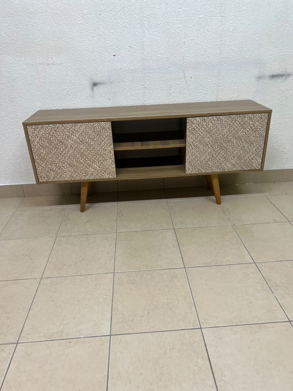 A modern wooden TV cabinet featuring distinctive textured woven doors and angled legs, closely resembling the Techno Mobili TV stand or Danube Home TV units. - Image 11