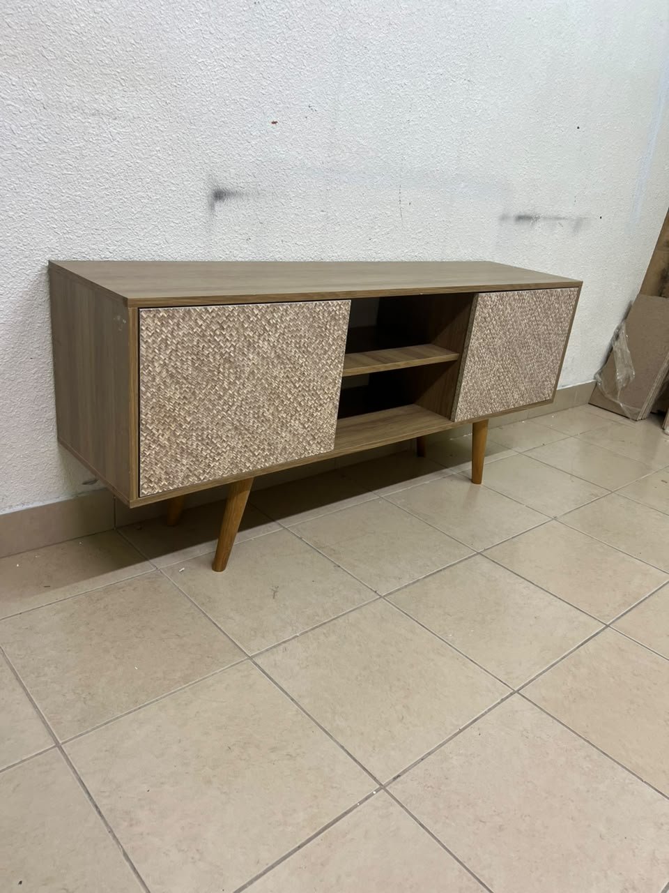 A modern wooden TV cabinet featuring distinctive textured woven doors and angled legs, closely resembling the Techno Mobili TV stand or Danube Home TV units. - Image 12