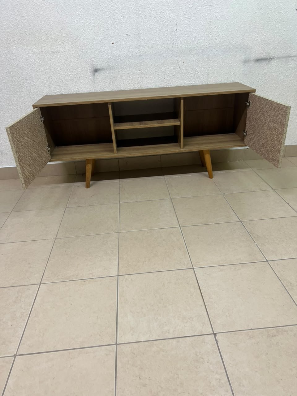 A modern wooden TV cabinet featuring distinctive textured woven doors and angled legs, closely resembling the Techno Mobili TV stand or Danube Home TV units. - Image 13