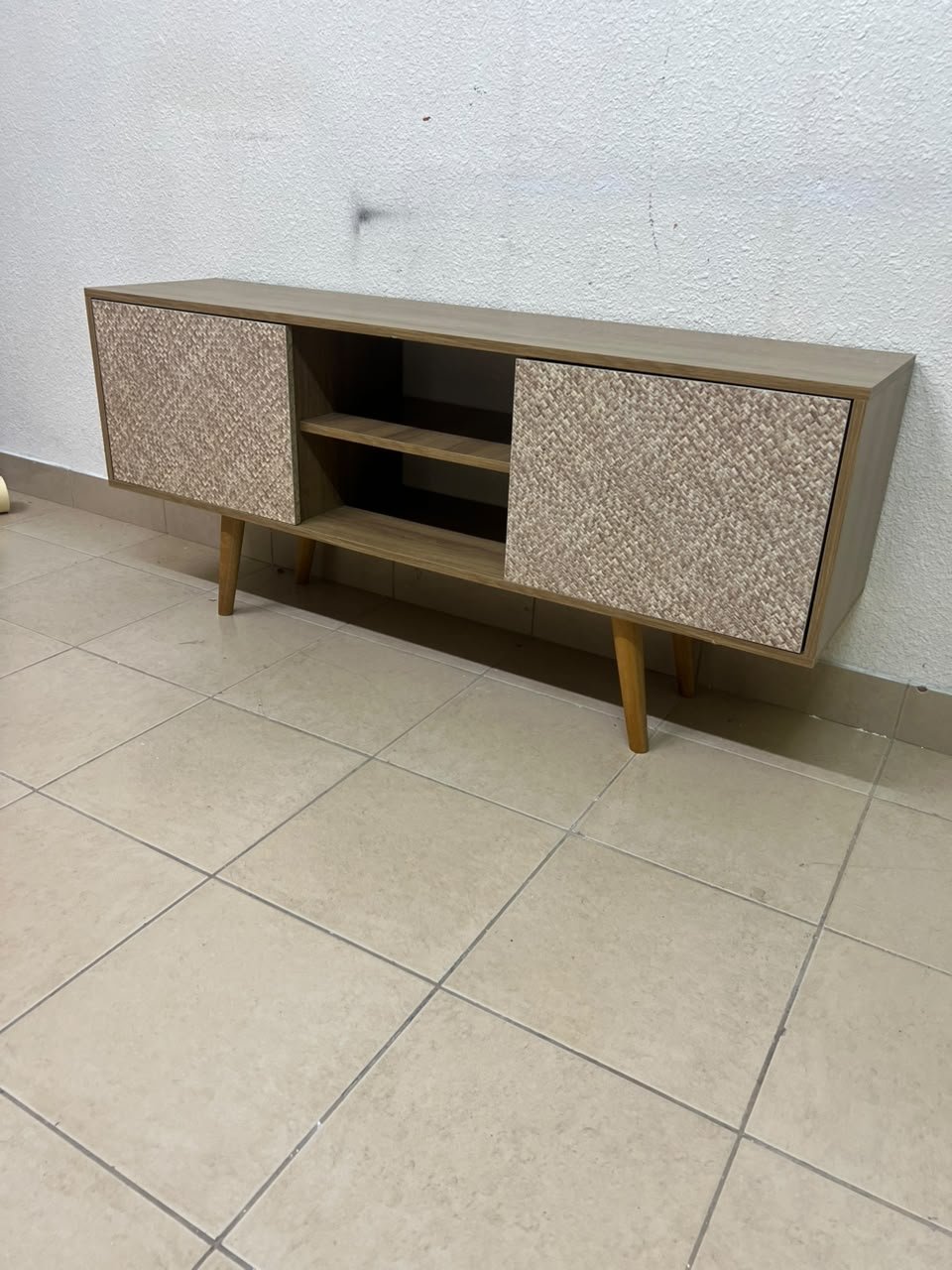 A modern wooden TV cabinet featuring distinctive textured woven doors and angled legs, closely resembling the Techno Mobili TV stand or Danube Home TV units. - Image 8