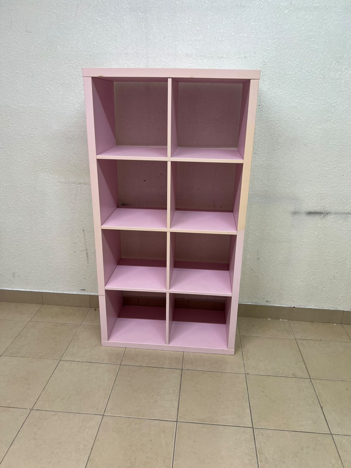 IKEA KALLAX shelving unit in pink, featuring a modular, 8-compartment cube design. - Image 2