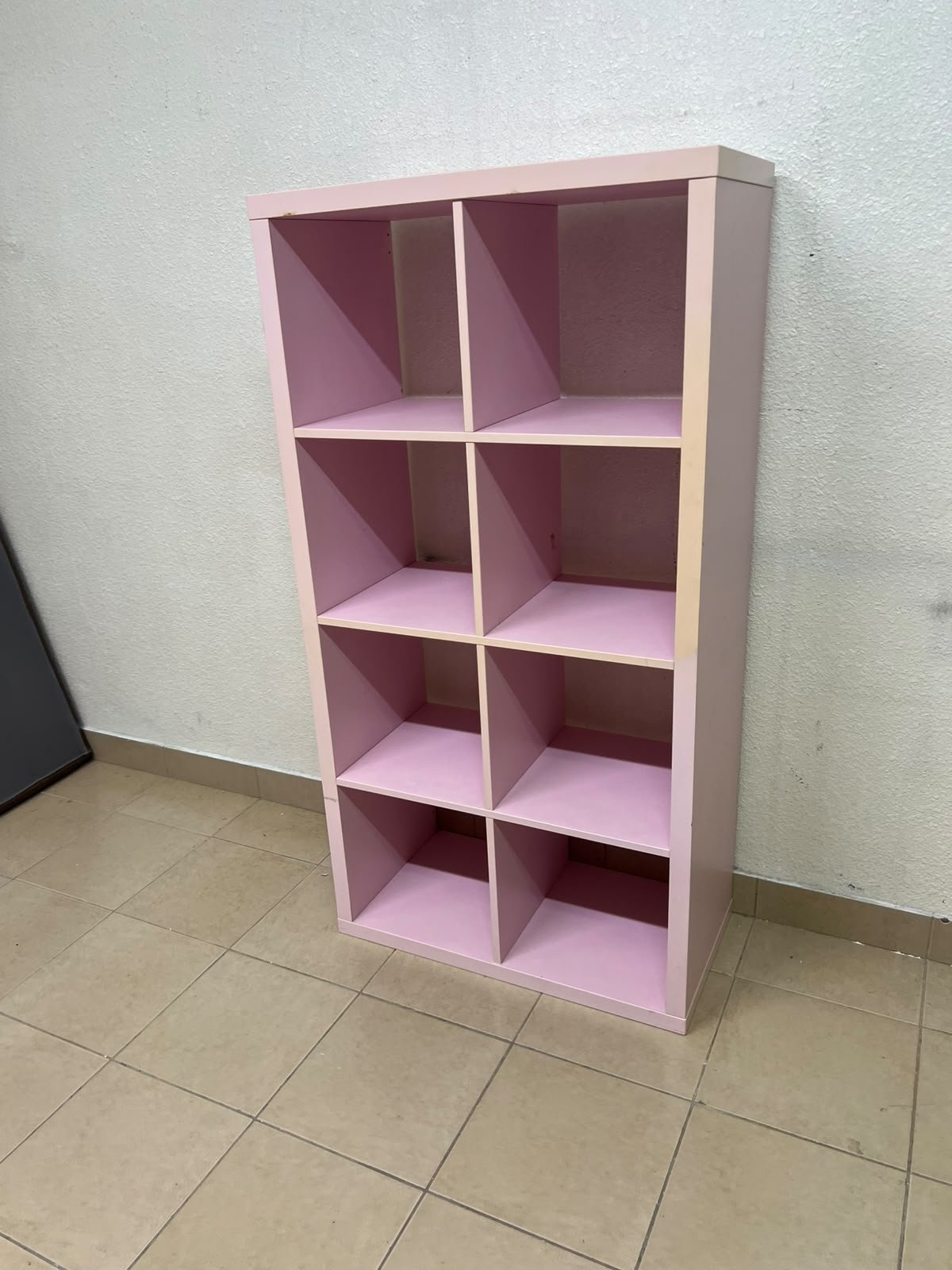 IKEA KALLAX shelving unit in pink, featuring a modular, 8-compartment cube design. - Image 3