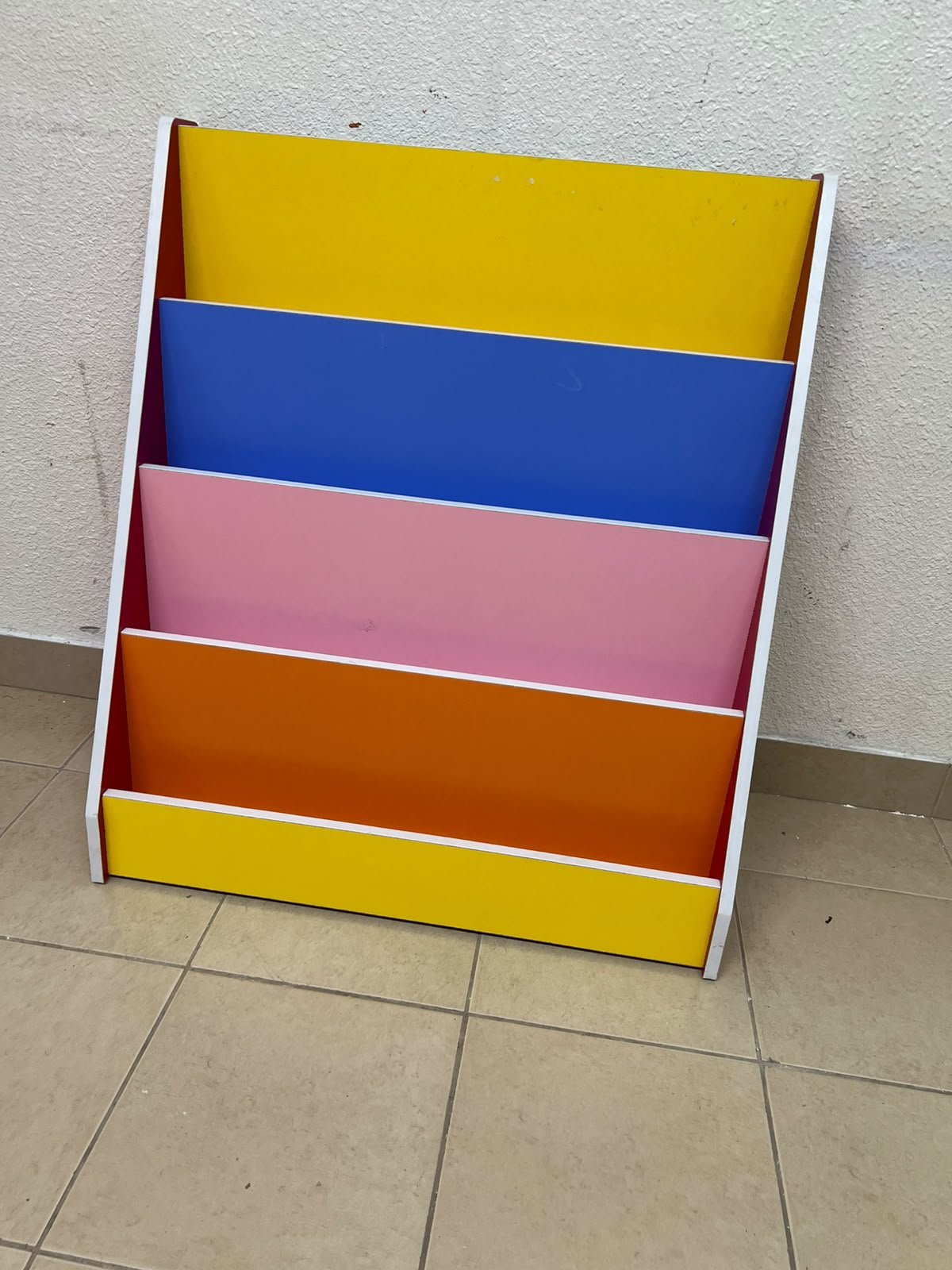 Colorful children's bookshelf with a multi-tiered wooden design. - Image 3