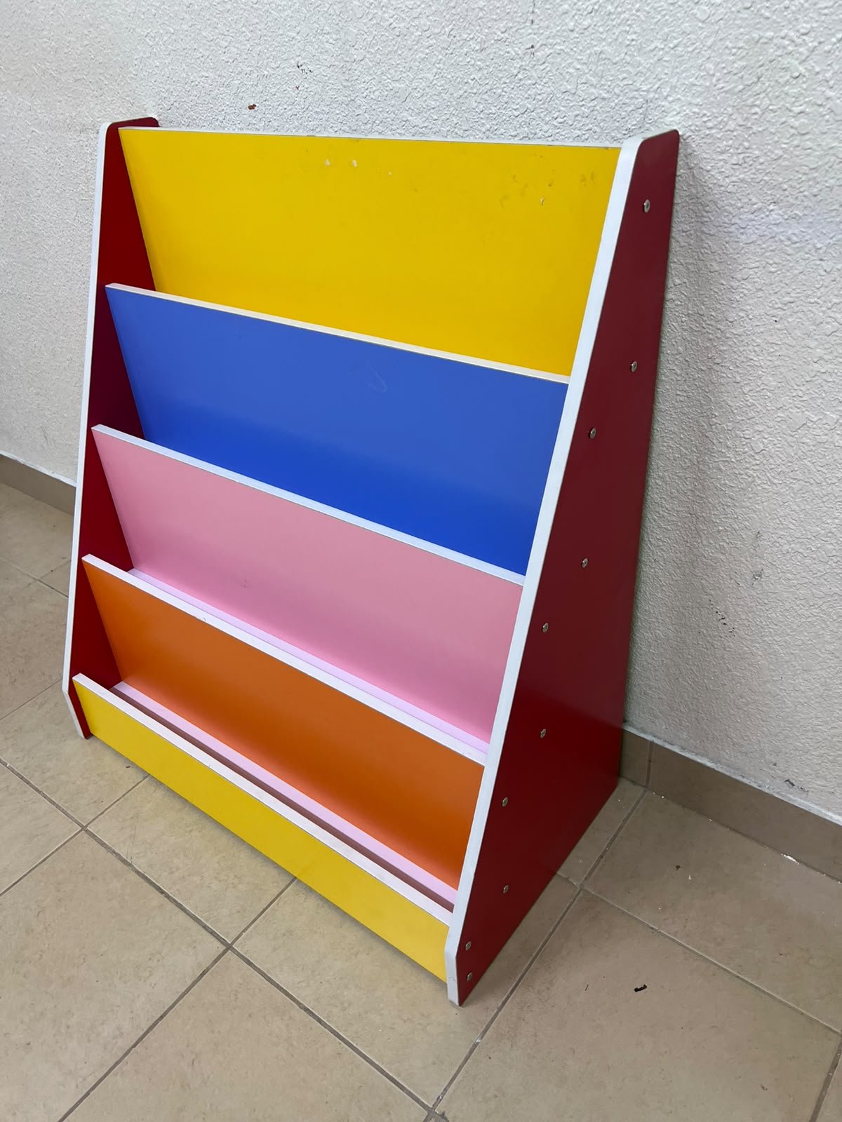 Colorful children's bookshelf with a multi-tiered wooden design. - Image 9