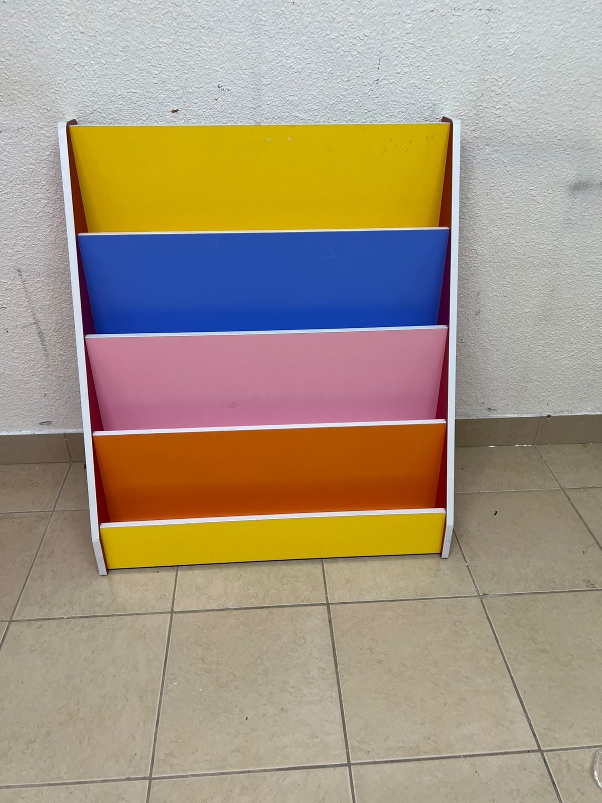 Colorful children's bookshelf with a multi-tiered wooden design. - Image 10