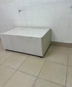 A coffee table upholstered in beige fabric with a textured feel and a neutral, linen-like appearance. - Image 10