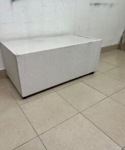 A coffee table upholstered in beige fabric with a textured feel and a neutral, linen-like appearance. - Image 7