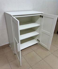 The white IKEA BRIMNES wardrobe features an elegant design with double paneled doors. - Image 9
