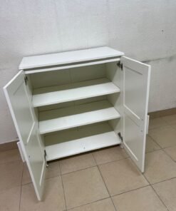 The white IKEA BRIMNES wardrobe features an elegant design with double paneled doors. - Image 10