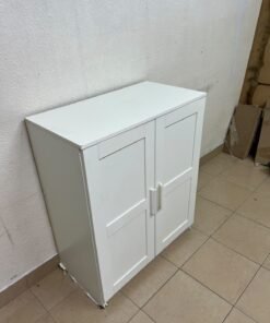 The white IKEA BRIMNES wardrobe features an elegant design with double paneled doors. - Image 11