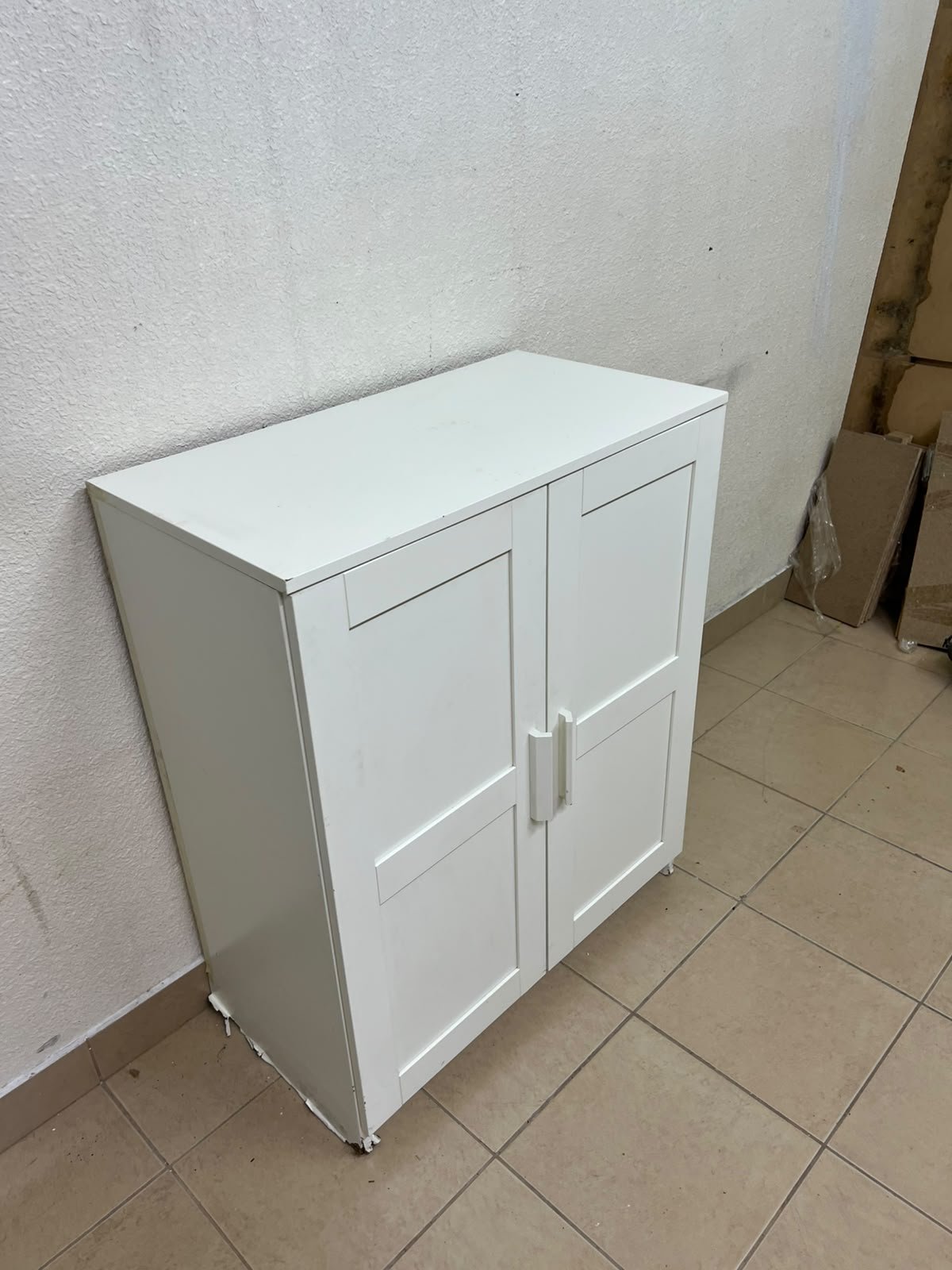 The white IKEA BRIMNES wardrobe features an elegant design with double paneled doors. - Image 11