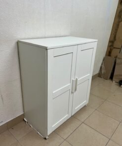 The white IKEA BRIMNES wardrobe features an elegant design with double paneled doors. - Image 2
