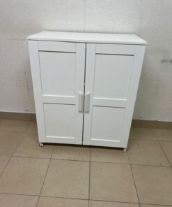 The white IKEA BRIMNES wardrobe features an elegant design with double paneled doors. - Image 3