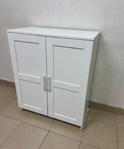 The white IKEA BRIMNES wardrobe features an elegant design with double paneled doors. - Image 4