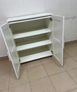 The white IKEA BRIMNES wardrobe features an elegant design with double paneled doors. - Image 5