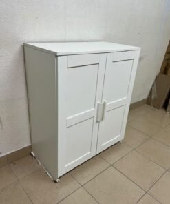 The white IKEA BRIMNES wardrobe features an elegant design with double paneled doors. - Image 6