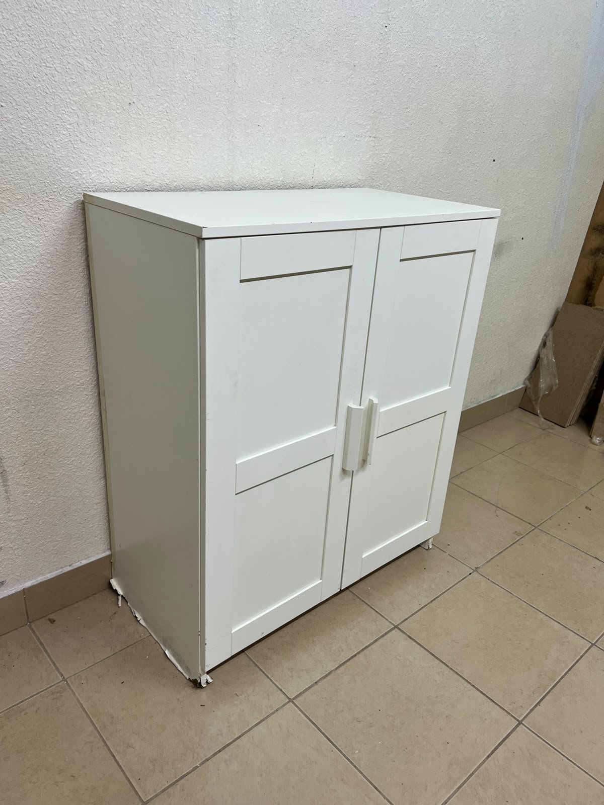 The white IKEA BRIMNES wardrobe features an elegant design with double paneled doors. - Image 6