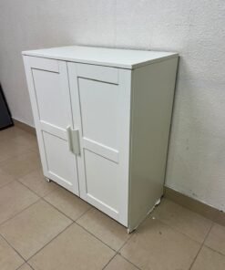 The white IKEA BRIMNES wardrobe features an elegant design with double paneled doors. - Image 7