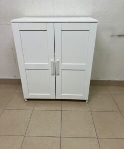 The white IKEA BRIMNES wardrobe features an elegant design with double paneled doors.