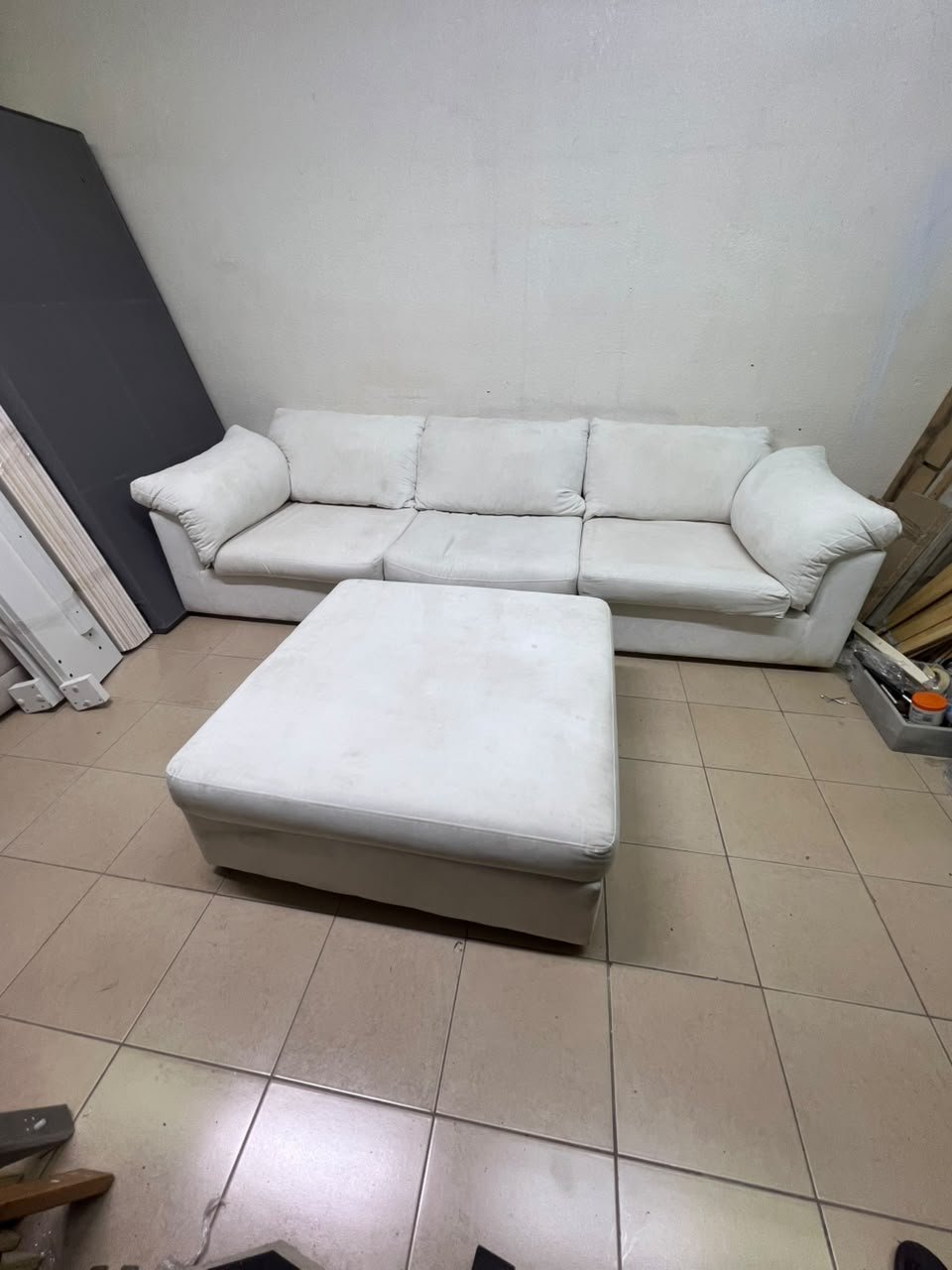 A modular white "Cloud-style" sectional sofa with a matching large ottoman, similar in design to options available at Danube Home. - Image 4