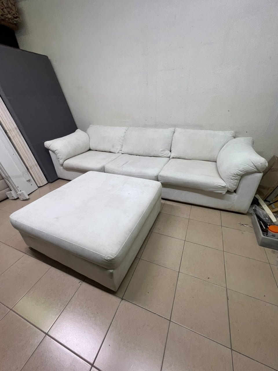A modular white "Cloud-style" sectional sofa with a matching large ottoman, similar in design to options available at Danube Home. - Image 6