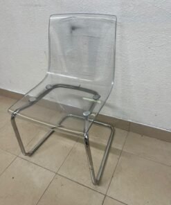 The IKEA "Tobias" chair, featuring a transparent acrylic seat and a chrome-plated steel frame. - Image 2