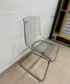 The IKEA "Tobias" chair, featuring a transparent acrylic seat and a chrome-plated steel frame. - Image 3