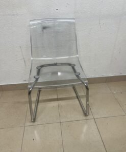 The IKEA "Tobias" chair, featuring a transparent acrylic seat and a chrome-plated steel frame. - Image 6