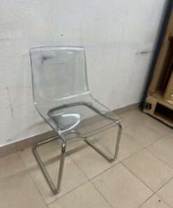 The IKEA "Tobias" chair, featuring a transparent acrylic seat and a chrome-plated steel frame. - Image 7
