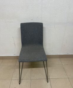The IKEA LILLÅNÄS chair, featuring a sleek cantilevered steel frame with a chrome-plated finish and upholstery in dark grey Gunnared fabric. - Image 2