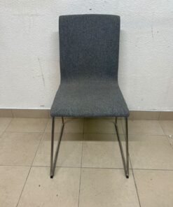 The IKEA LILLÅNÄS chair, featuring a sleek cantilevered steel frame with a chrome-plated finish and upholstery in dark grey Gunnared fabric. - Image 4