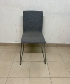 The IKEA LILLÅNÄS chair, featuring a sleek cantilevered steel frame with a chrome-plated finish and upholstery in dark grey Gunnared fabric. - Image 6