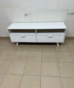 A modern, white, freestanding TV stand featuring angled legs and two large lower storage drawers, topped by open shelves. - Image 9